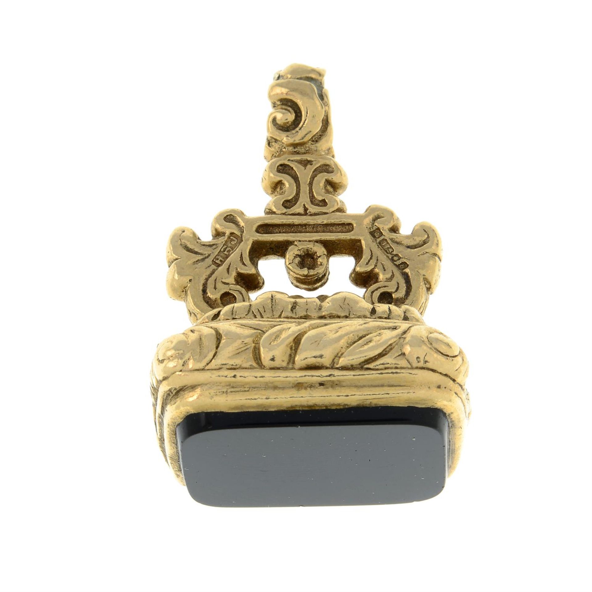 A 1970s 9ct gold onyx fob.