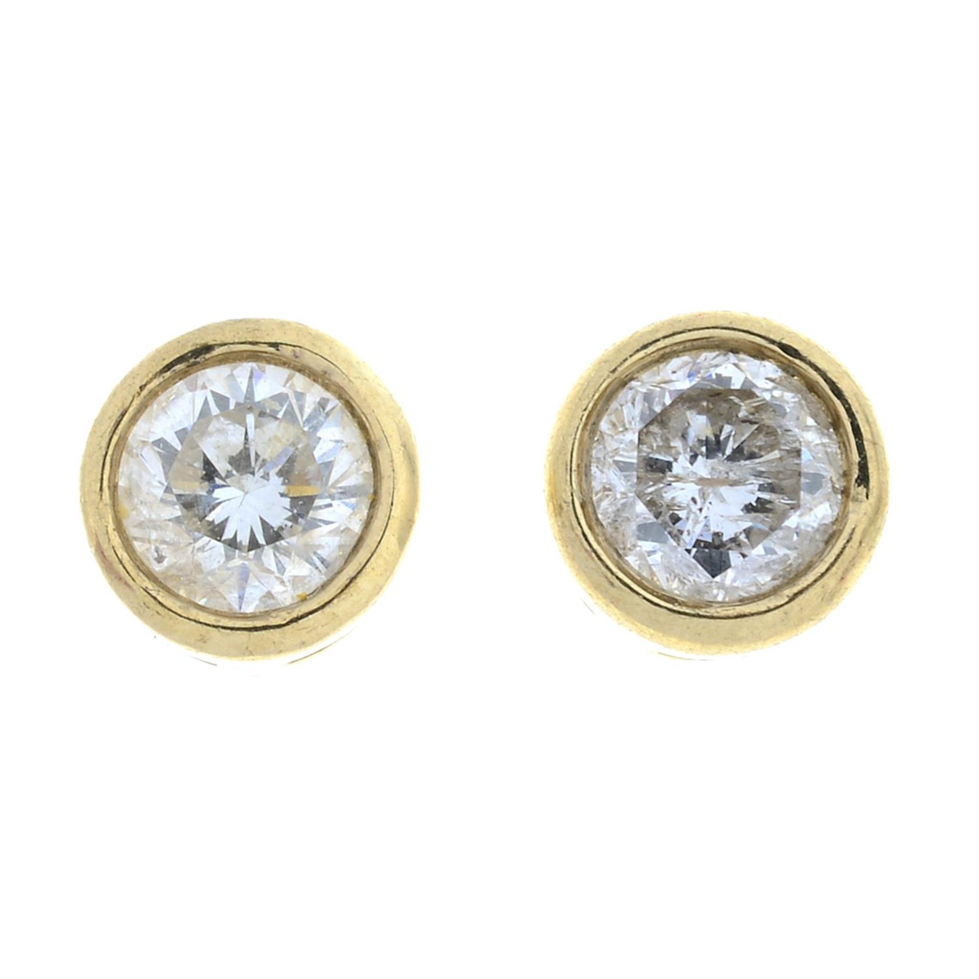 A pair of 9ct gold brilliant-cut diamond stud earrings.