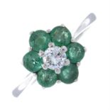 An 18ct gold emerald and brilliant-cut diamond cluster ring.