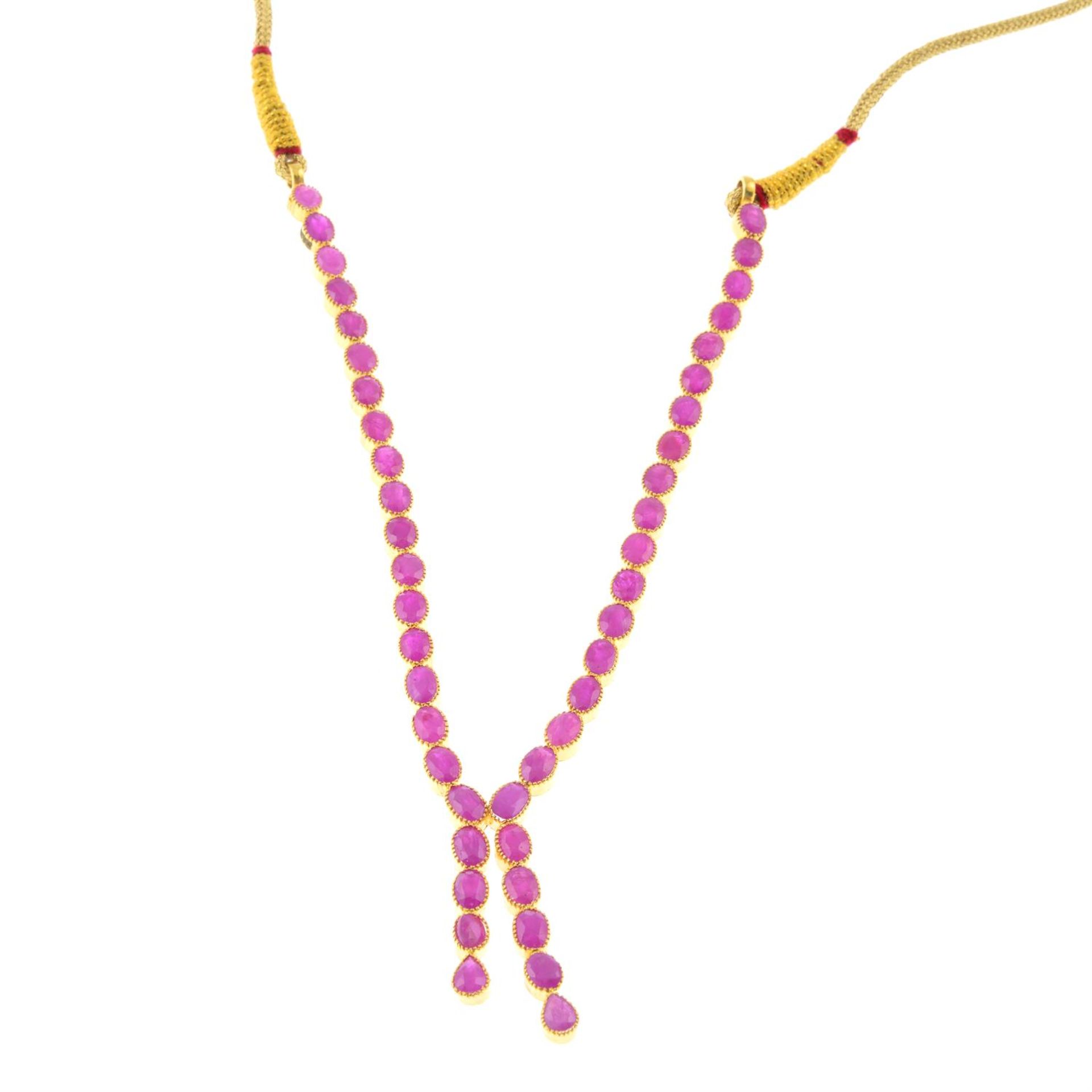 A ruby, imitation pearl and paste necklace with cord fastening.