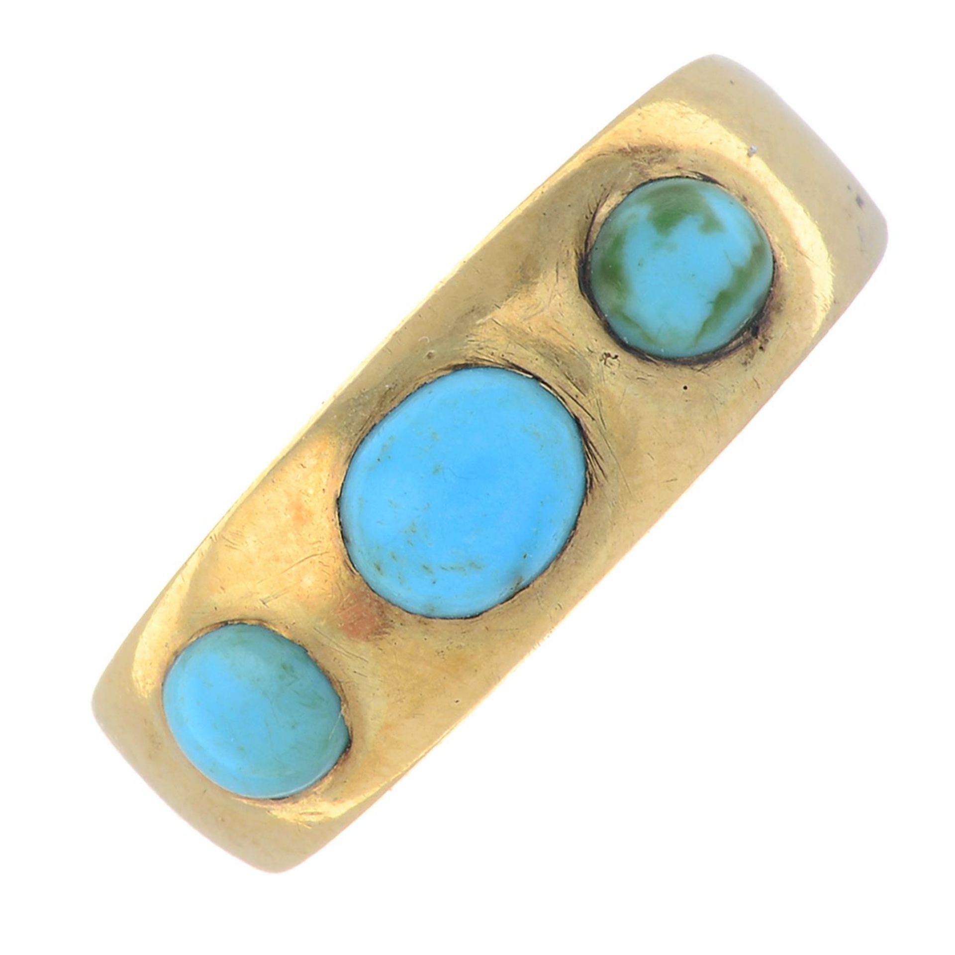 A turquoise three-stone ring.