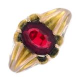 An early 20th century 9ct gold garnet-topped-doublet single-stone ring.
