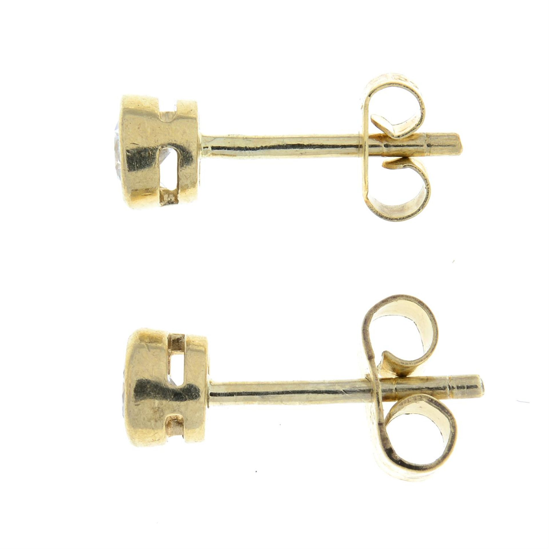 A pair of 9ct gold brilliant-cut diamond stud earrings. - Image 2 of 2