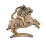 A jousting man on a horse back brooch.