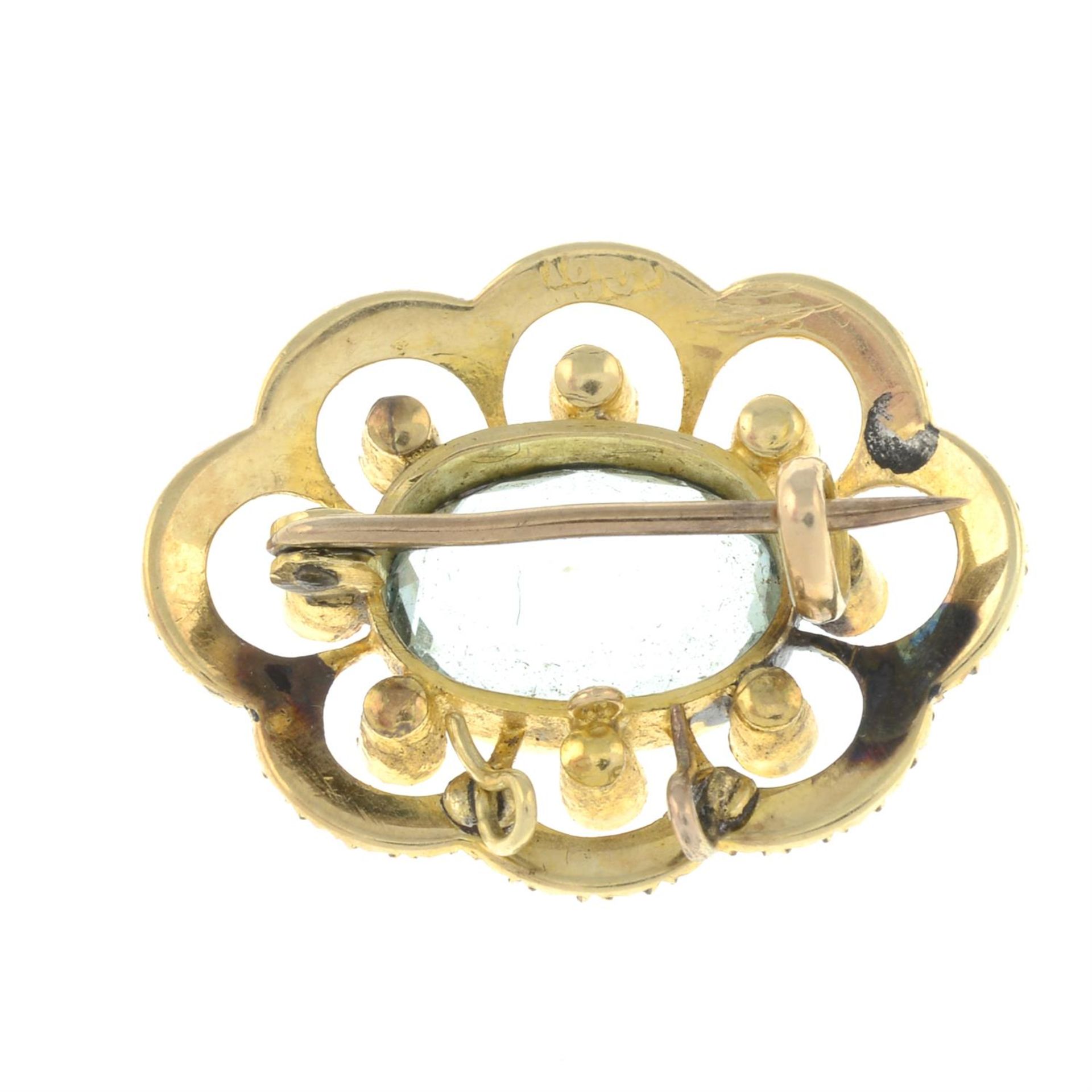 An early 20th century gold aquamarine and split pearl openwork brooch. - Image 2 of 2