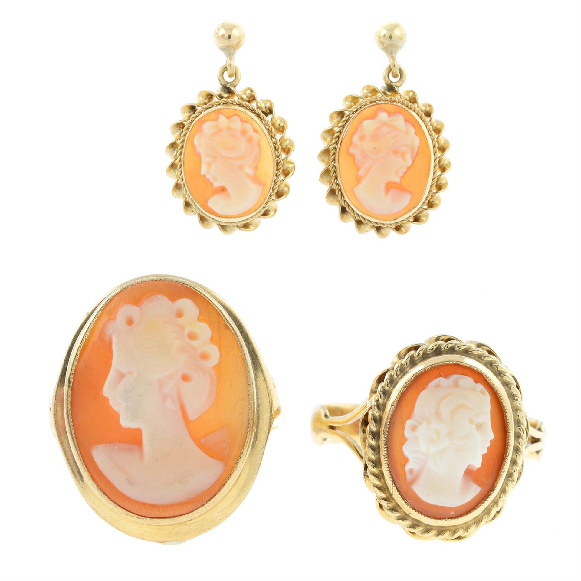 Two 9ct gold shell cameo rings and a pair of 9ct gold shell cameo drop earrings.