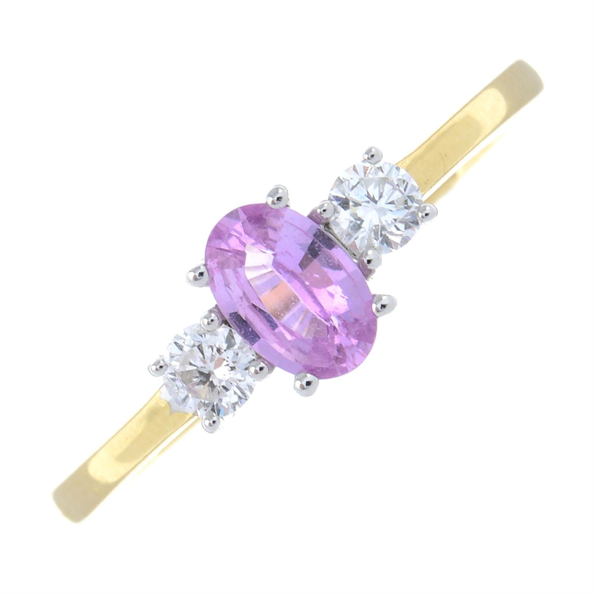 An 18ct gold pink sapphire and brilliant-cut diamond three-stone ring.