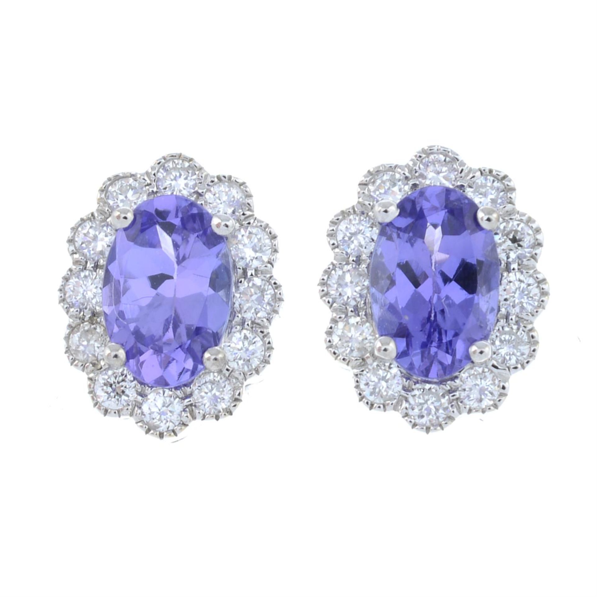 A pair of 18ct gold tanzanite and brilliant-cut diamond cluster earrings.