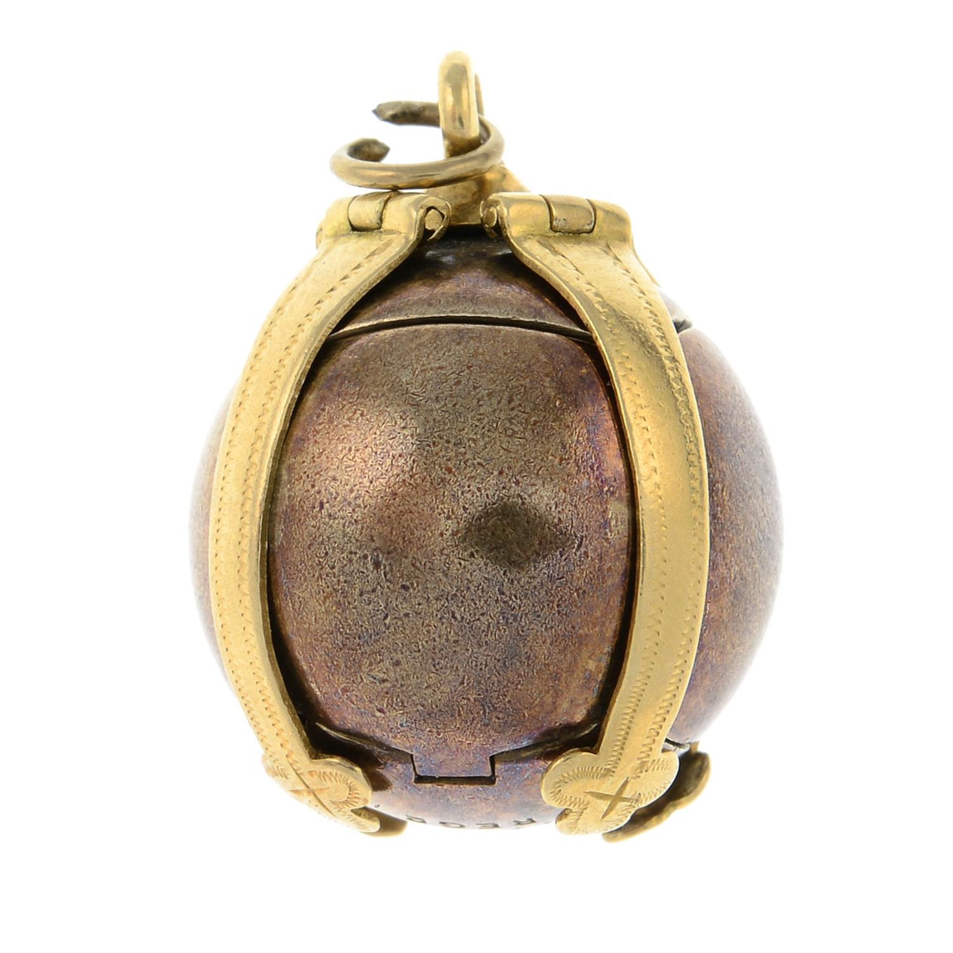 A mid 20th century 18ct gold and silver Masonic ball pendant.