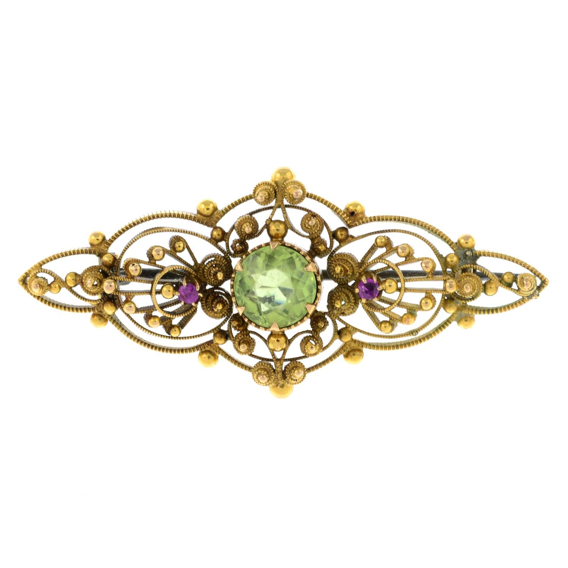 An early 20th century 15ct gold peridot and ruby cannetille brooch.