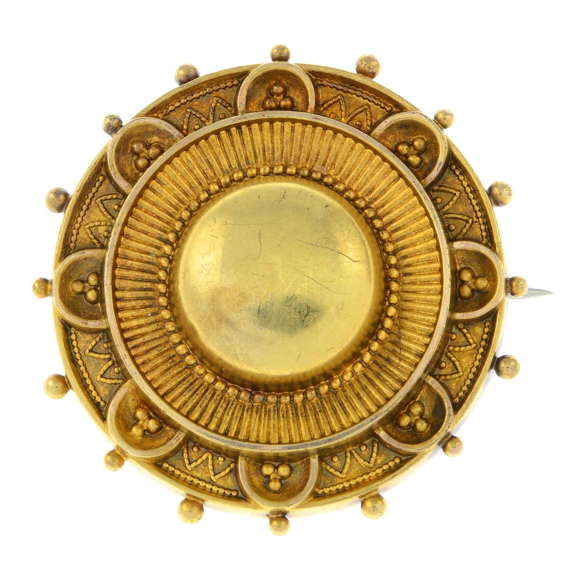 A late Victorian 15ct gold shield shaped memorial locket brooch.
