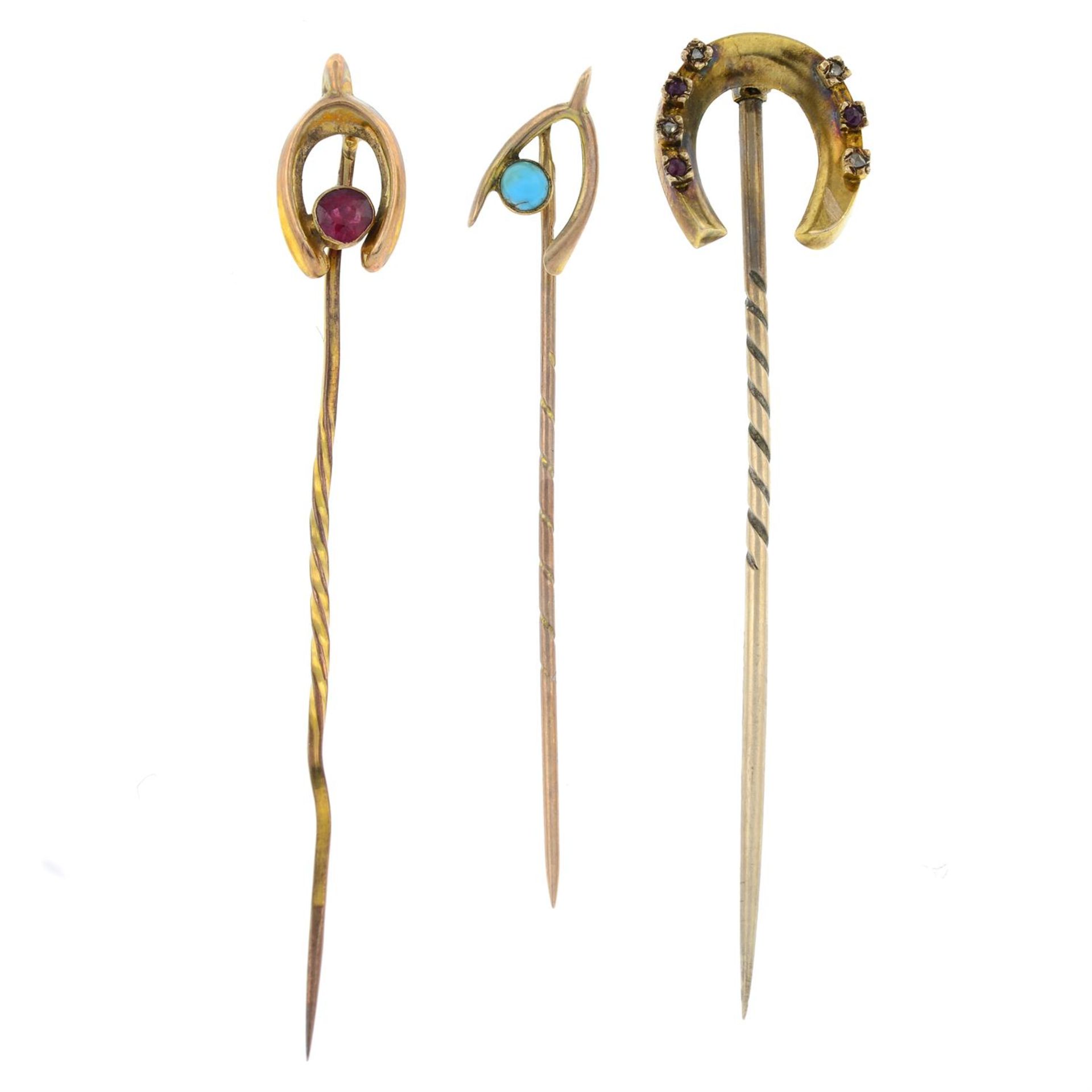 Three early 20th century gold stick pins.