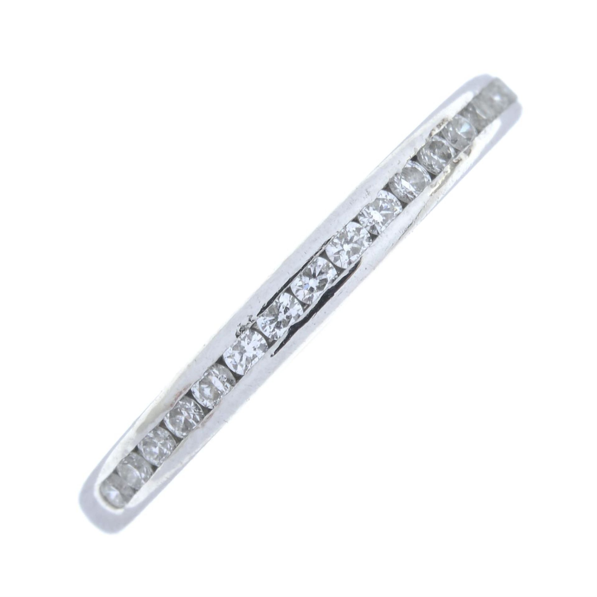 A brilliant-cut diamond half eternity ring, by Tiffany & Co.