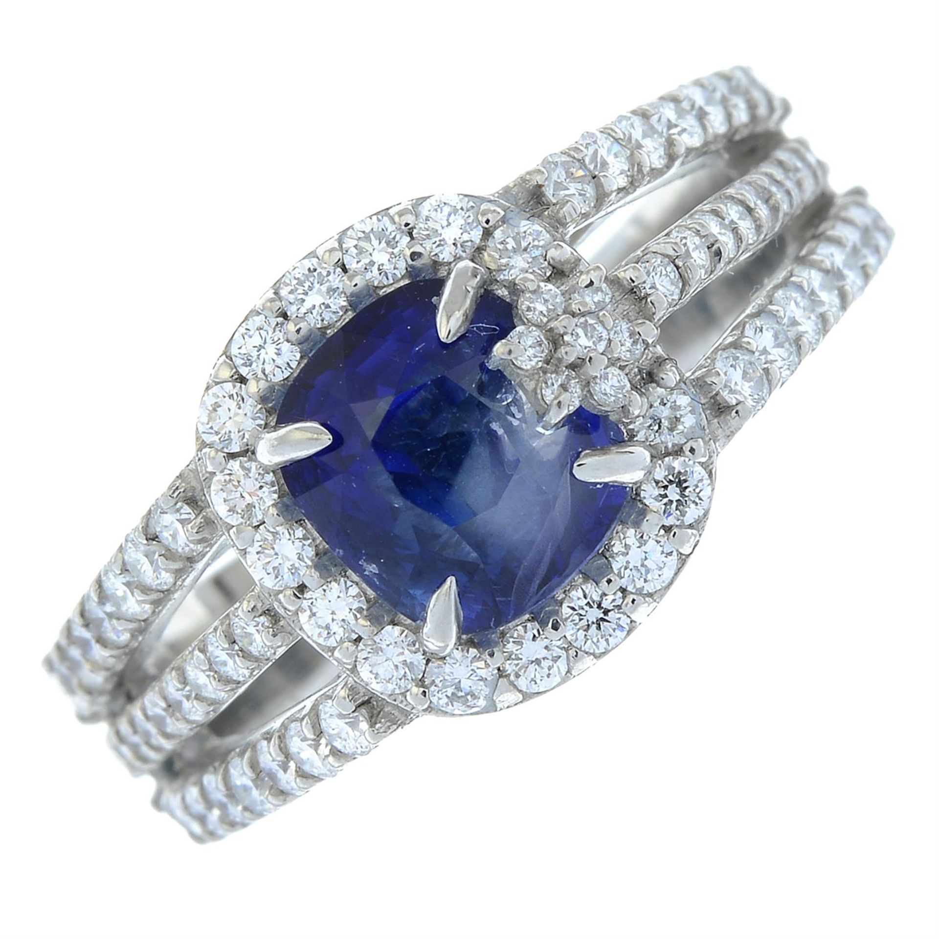 A platinum sapphire and brilliant-cut diamond floral accent dress ring.