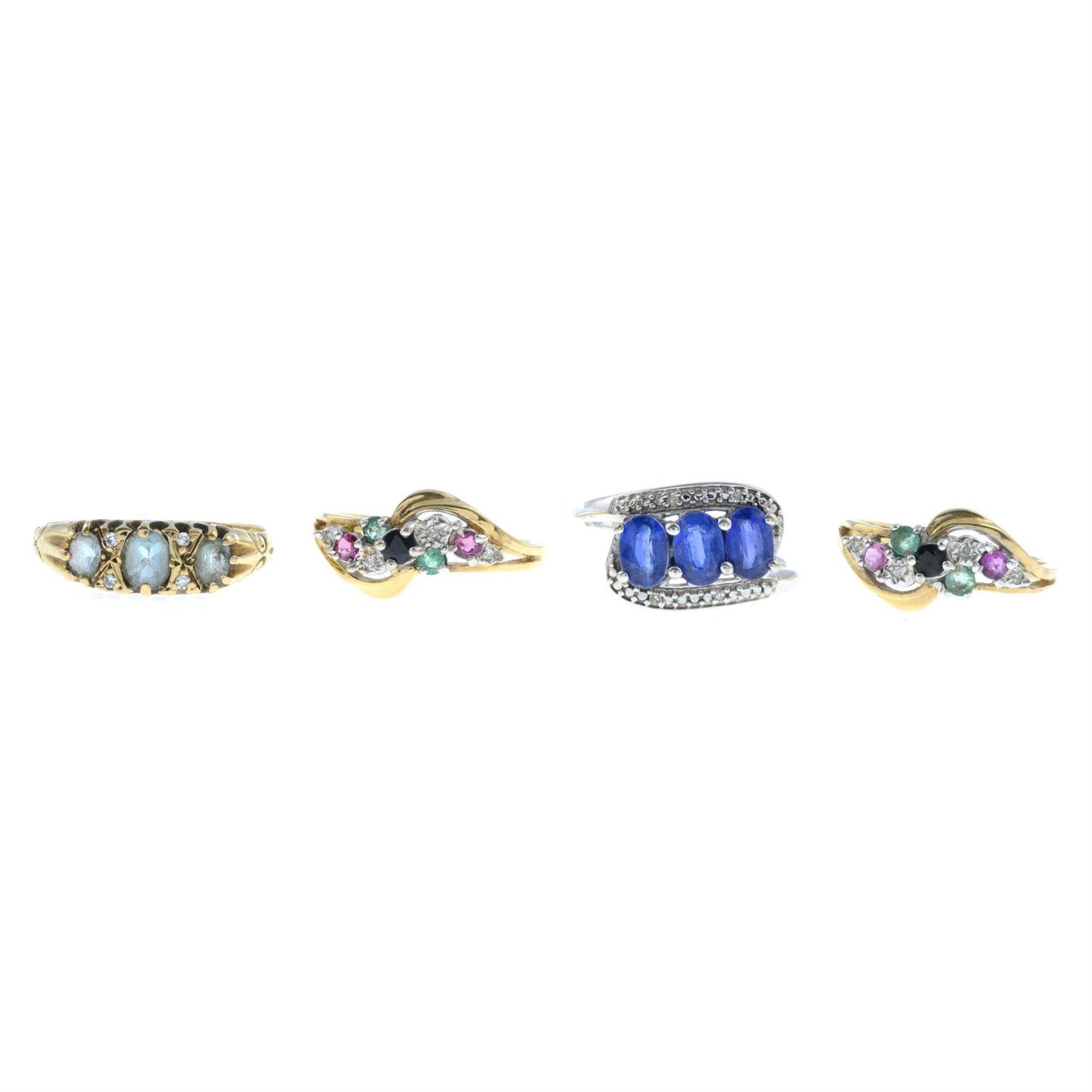 Four 9ct gold gem set rings.