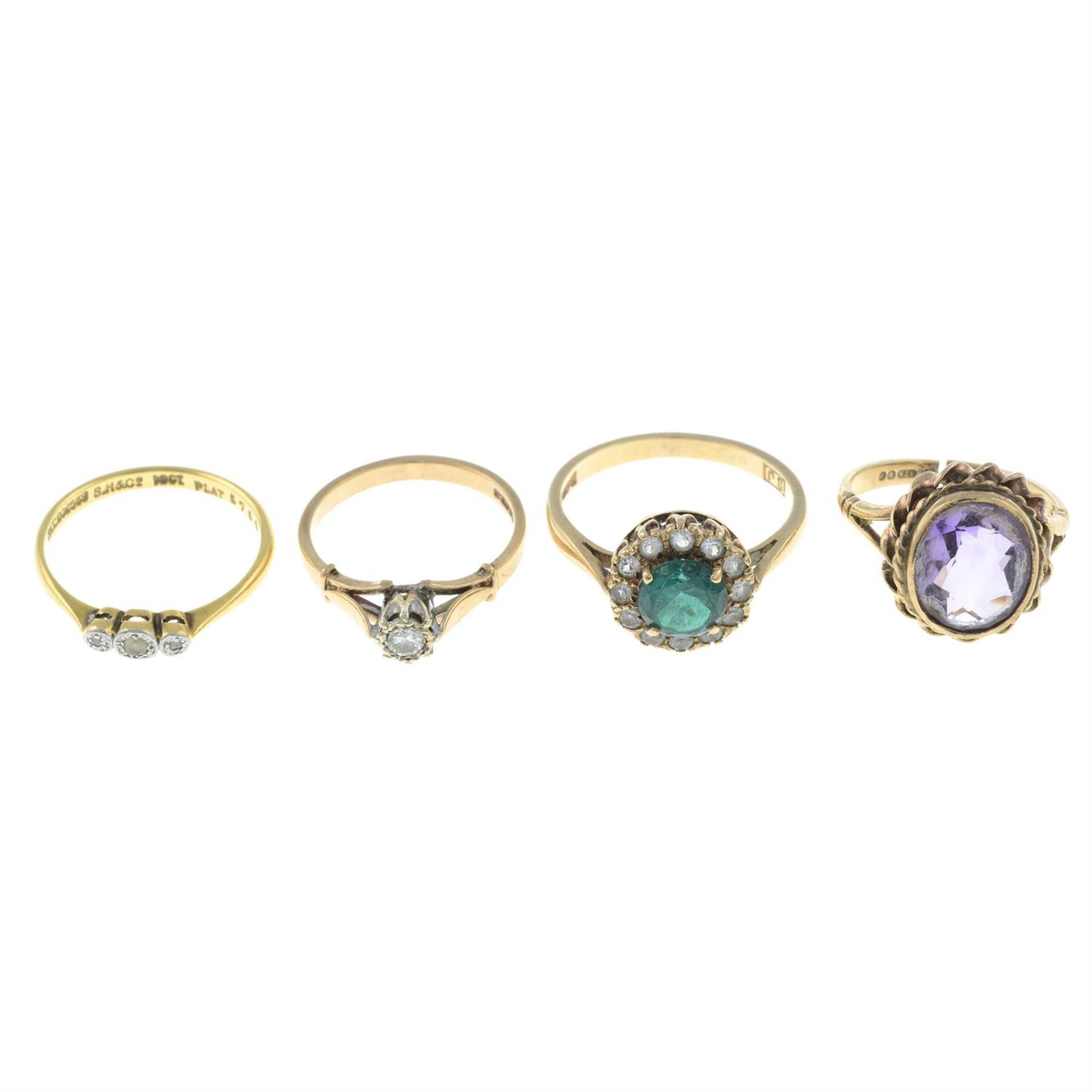 Four gem-set rings.