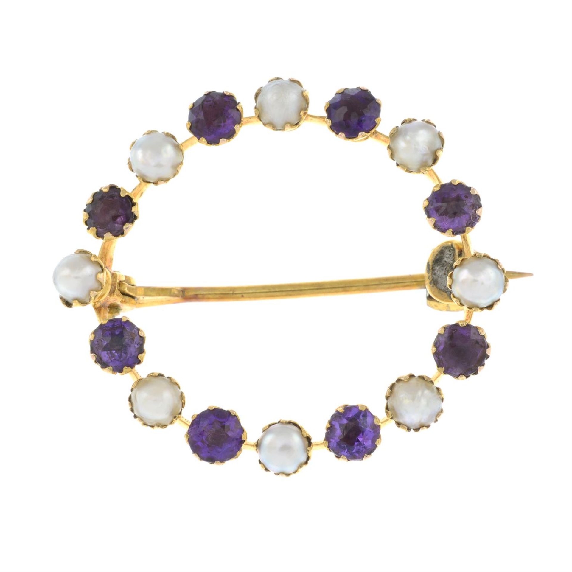 An early 20th century 15ct gold amethyst and split pearl brooch.