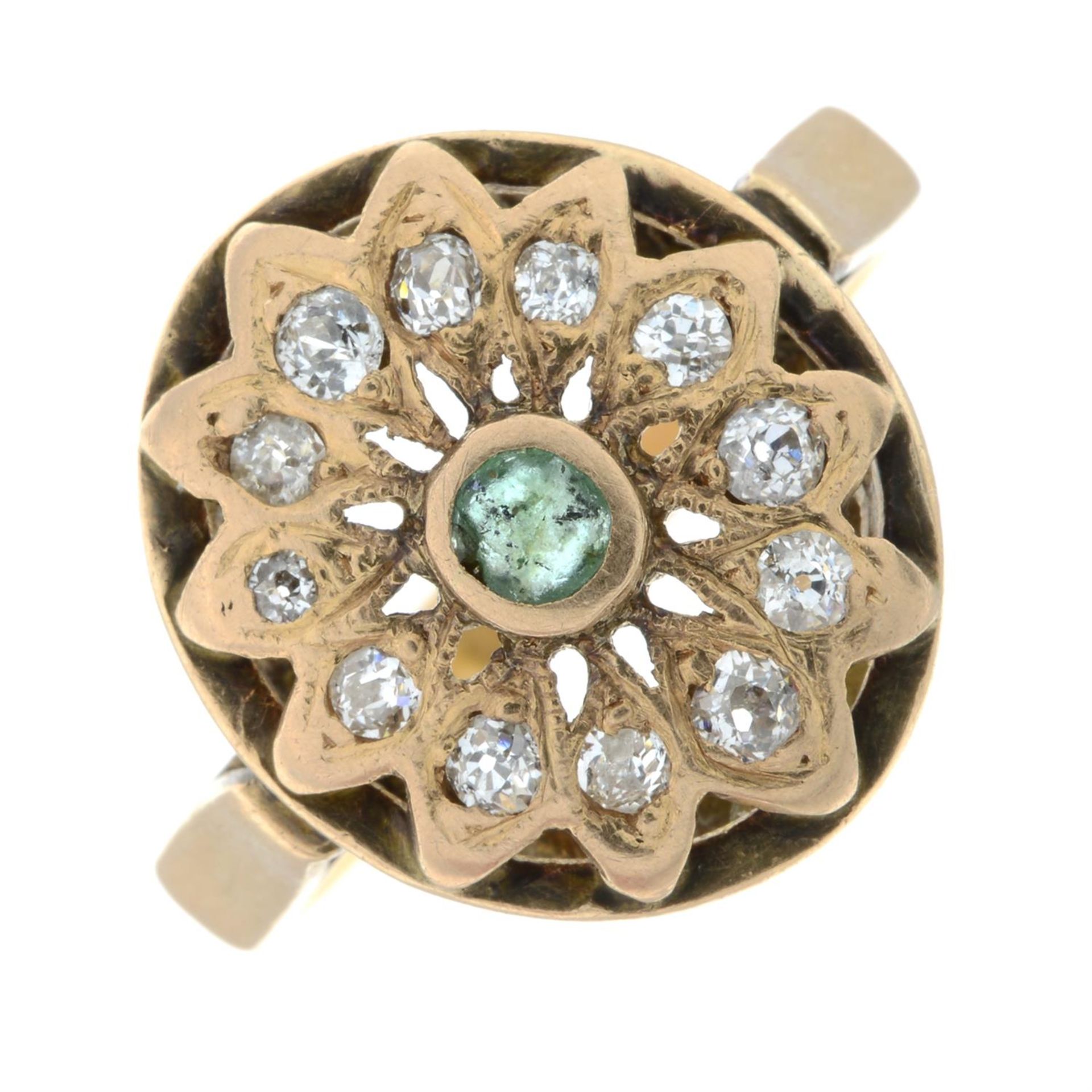 An emerald and old-cut diamond cluster ring.