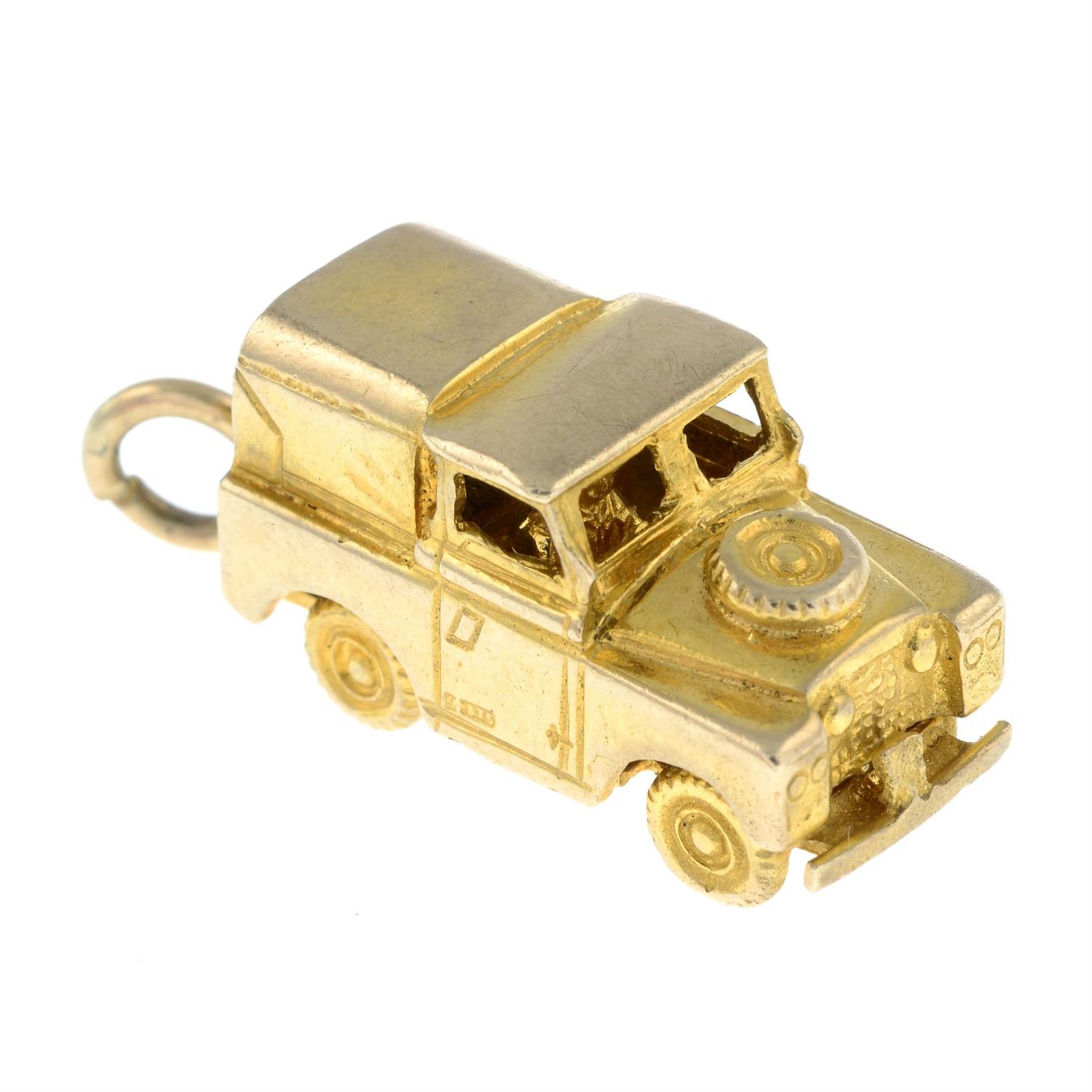 A 1960s 9ct gold Land Rover Series IIA charm.