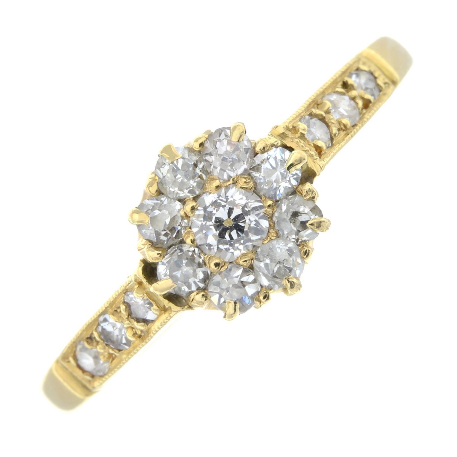 An old-cut diamond cluster ring.