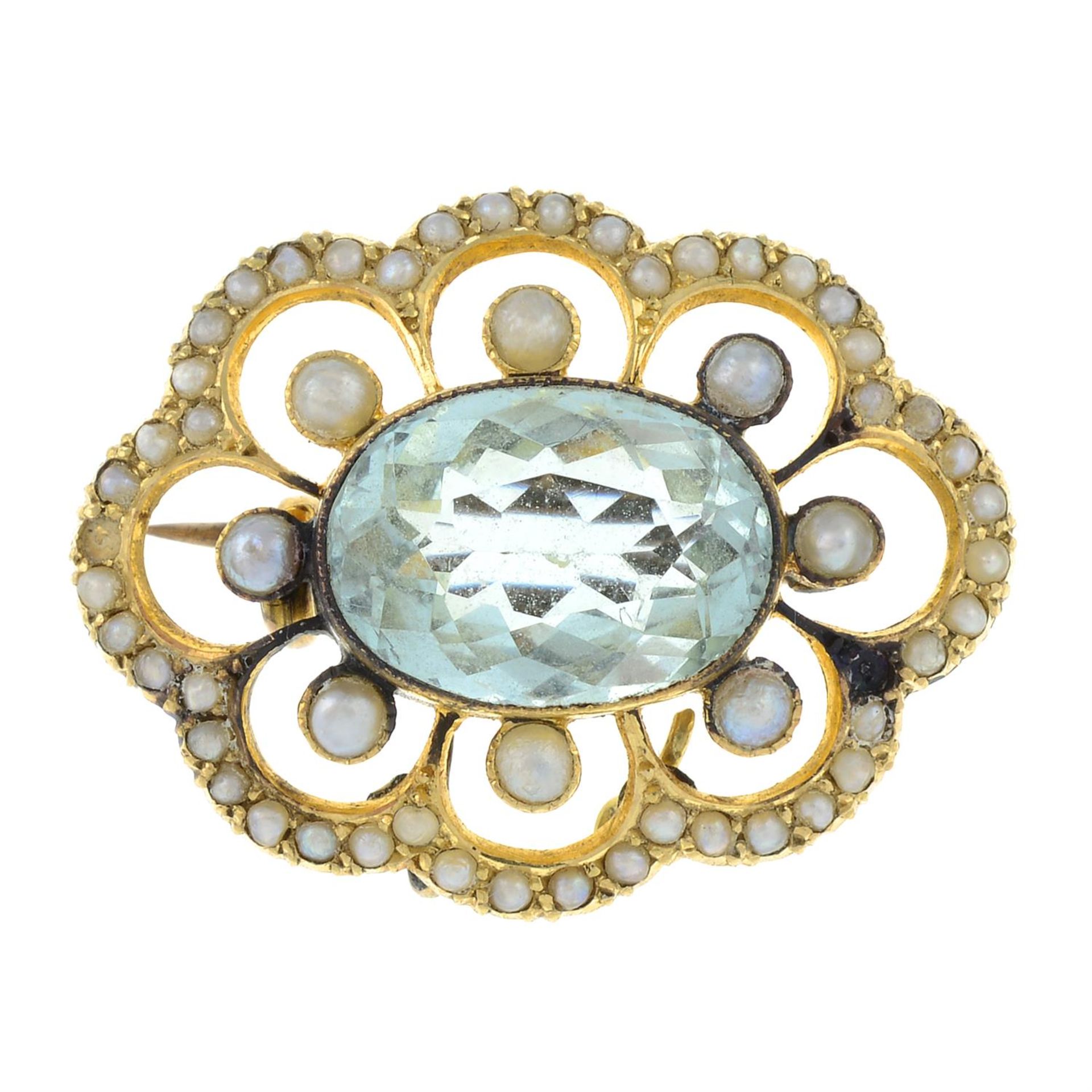 An early 20th century gold aquamarine and split pearl openwork brooch.