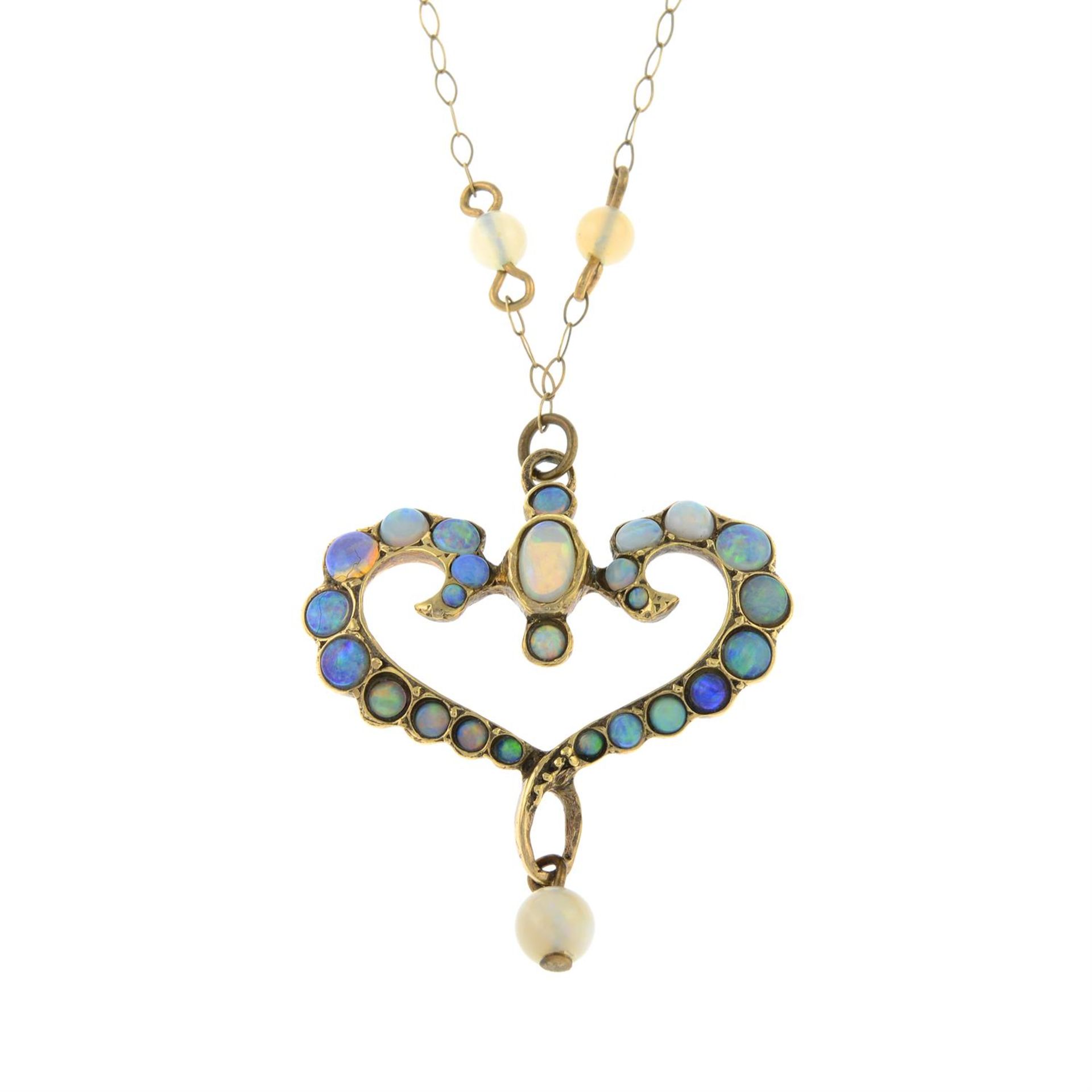 A late Victorian 15ct gold opal heart-shaped pendant, on integral chain with opal spacers,