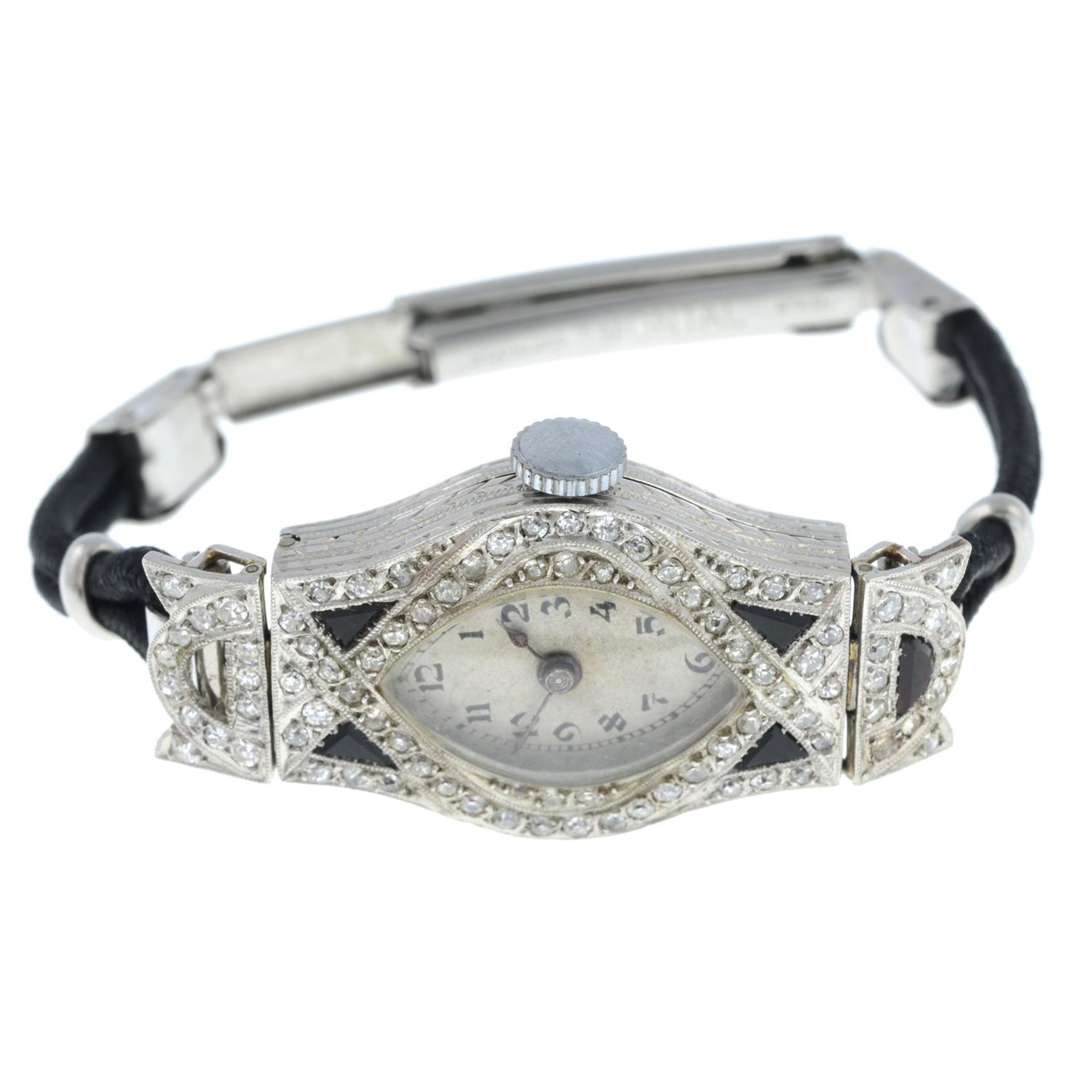 An Art Deco platinum old-cut diamond and onyx cocktail watch, with fabric and steel bracelet.