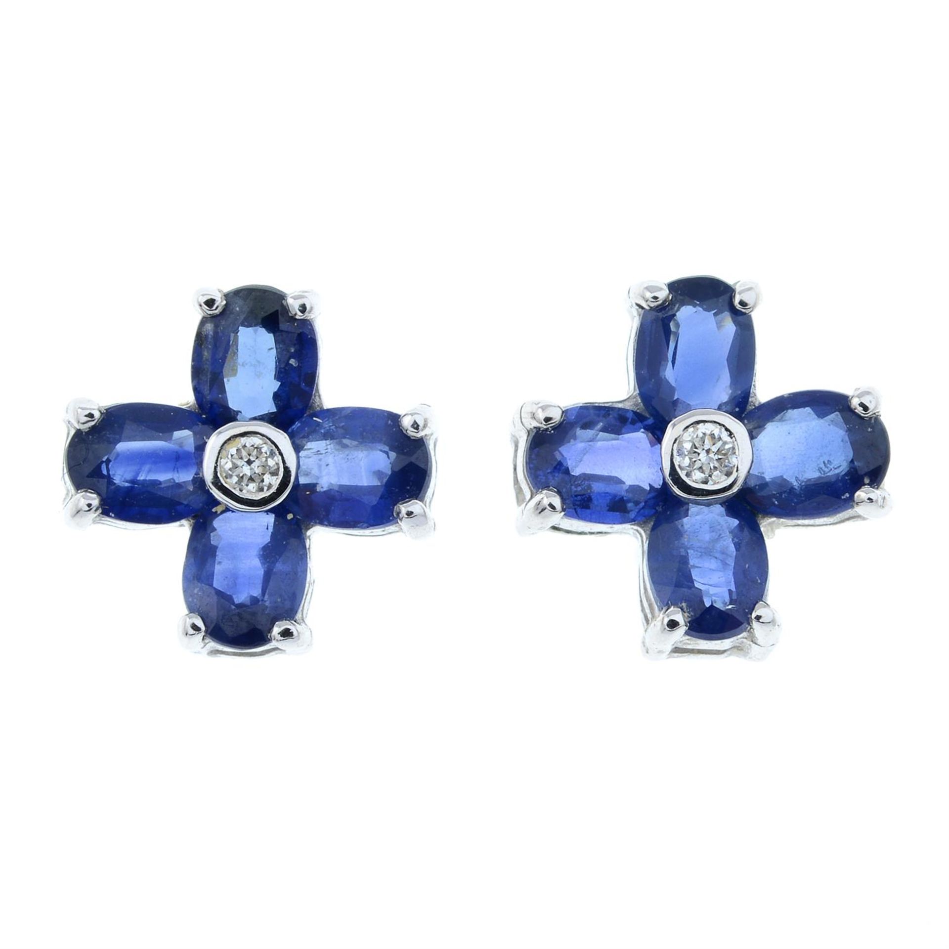 A pair of brilliant-cut diamond and sapphire floral design stud earrings.