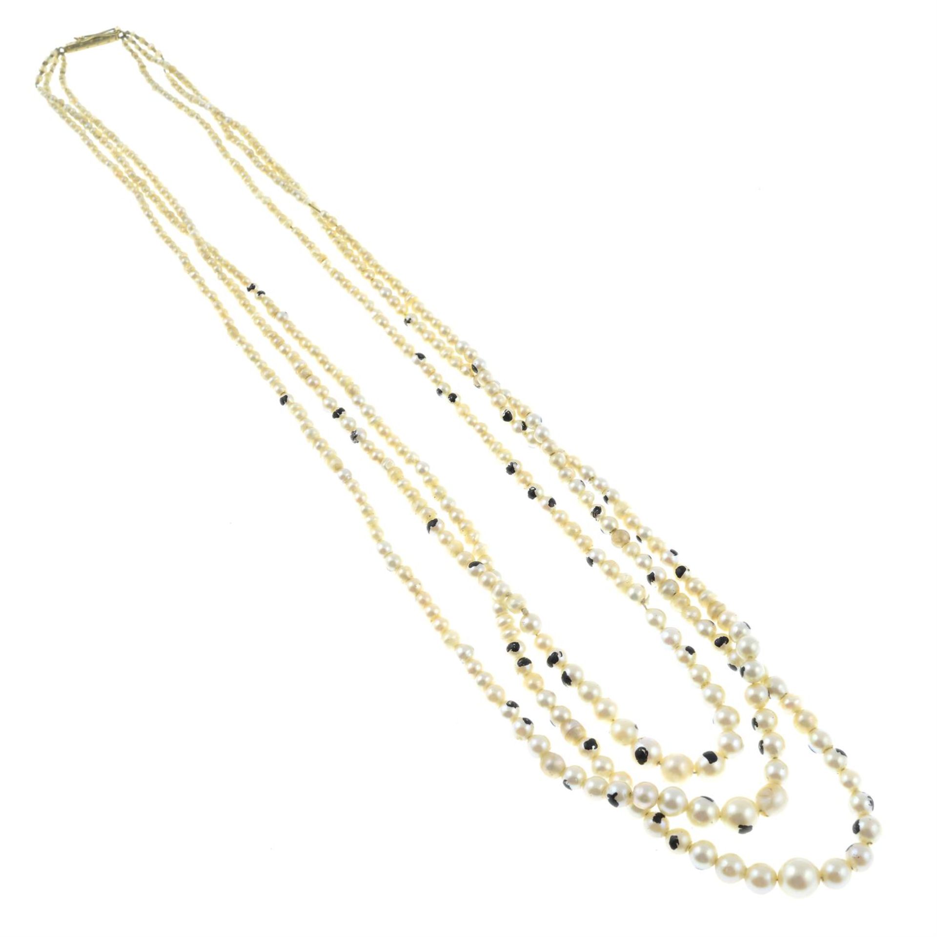 An early 20th century graduated natural, cultured and imitation pearl three-strand necklace. - Image 2 of 3