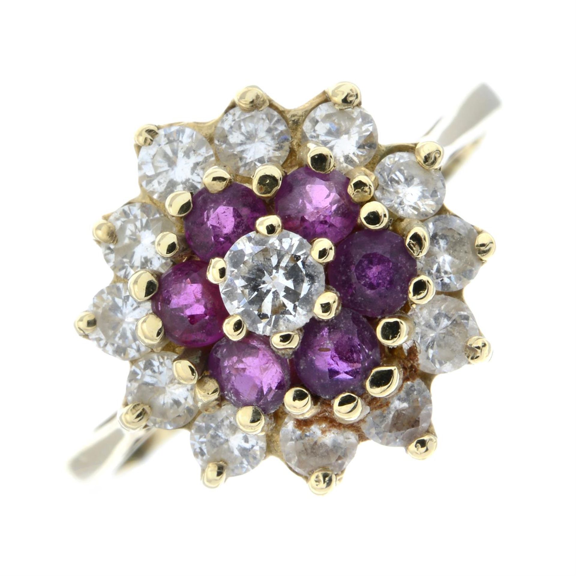 A 14ct gold ruby and brilliant-cut diamond floral cluster ring.