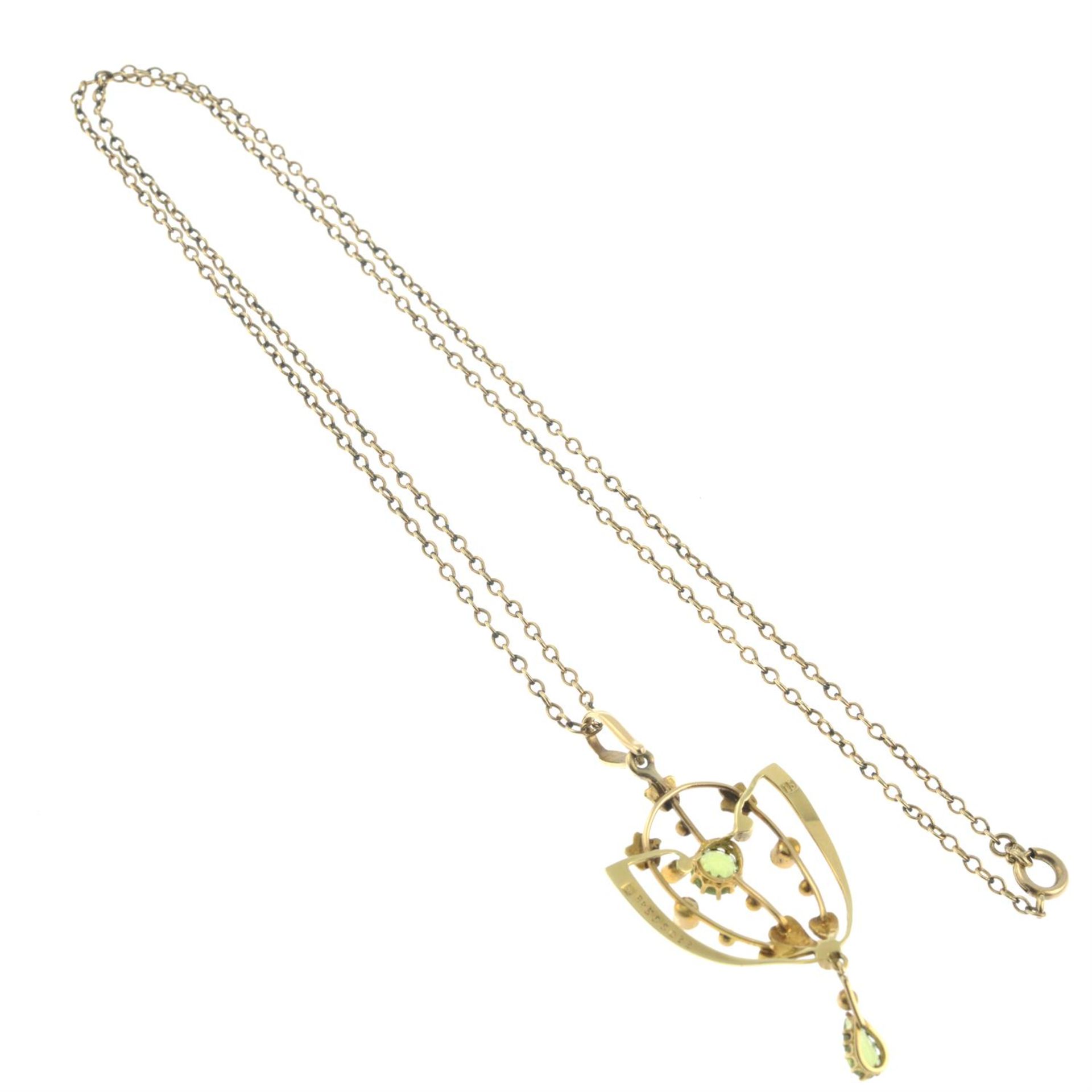 An early 20th century peridot and split pearl pendant, with trace-link chain. - Image 2 of 2