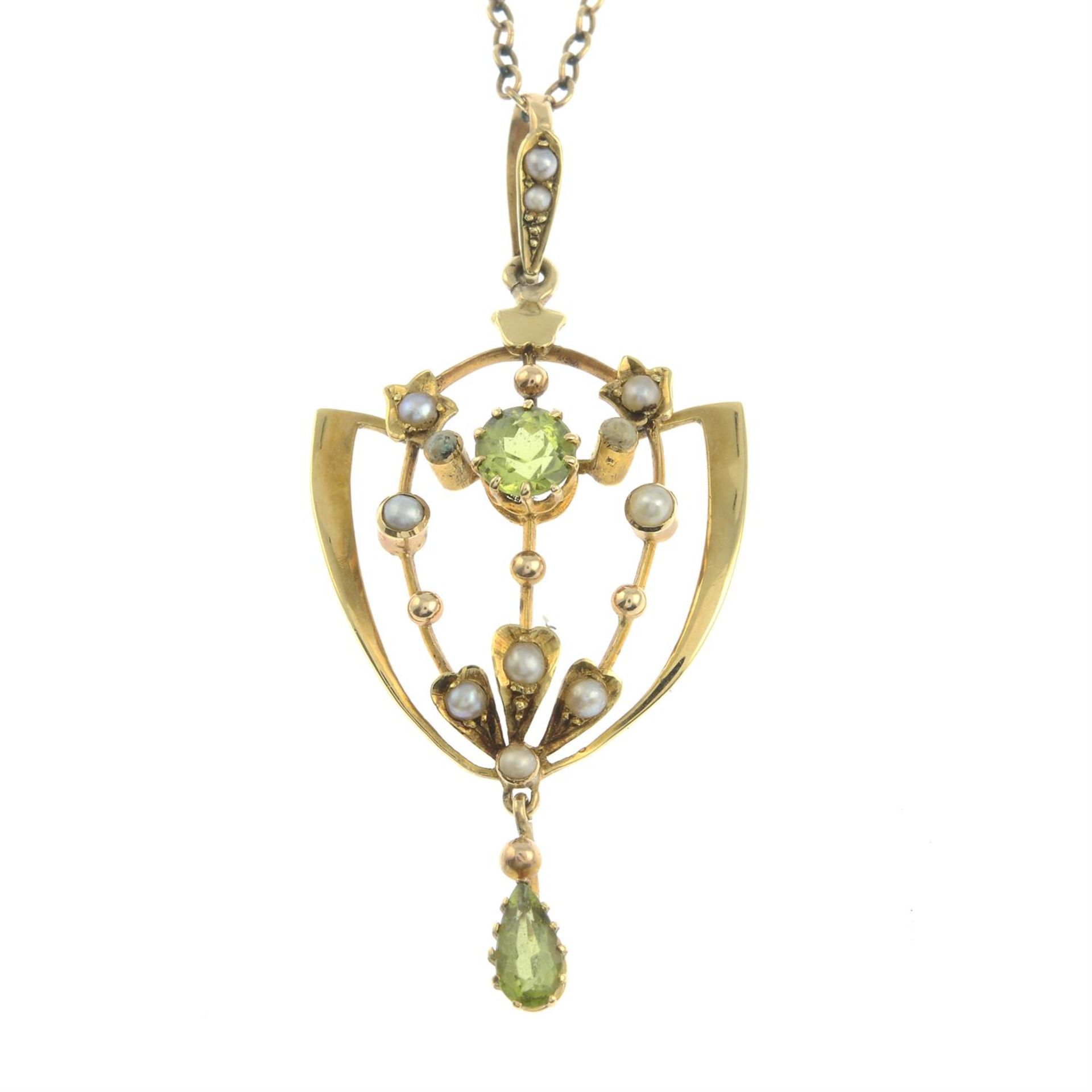 An early 20th century peridot and split pearl pendant, with trace-link chain.