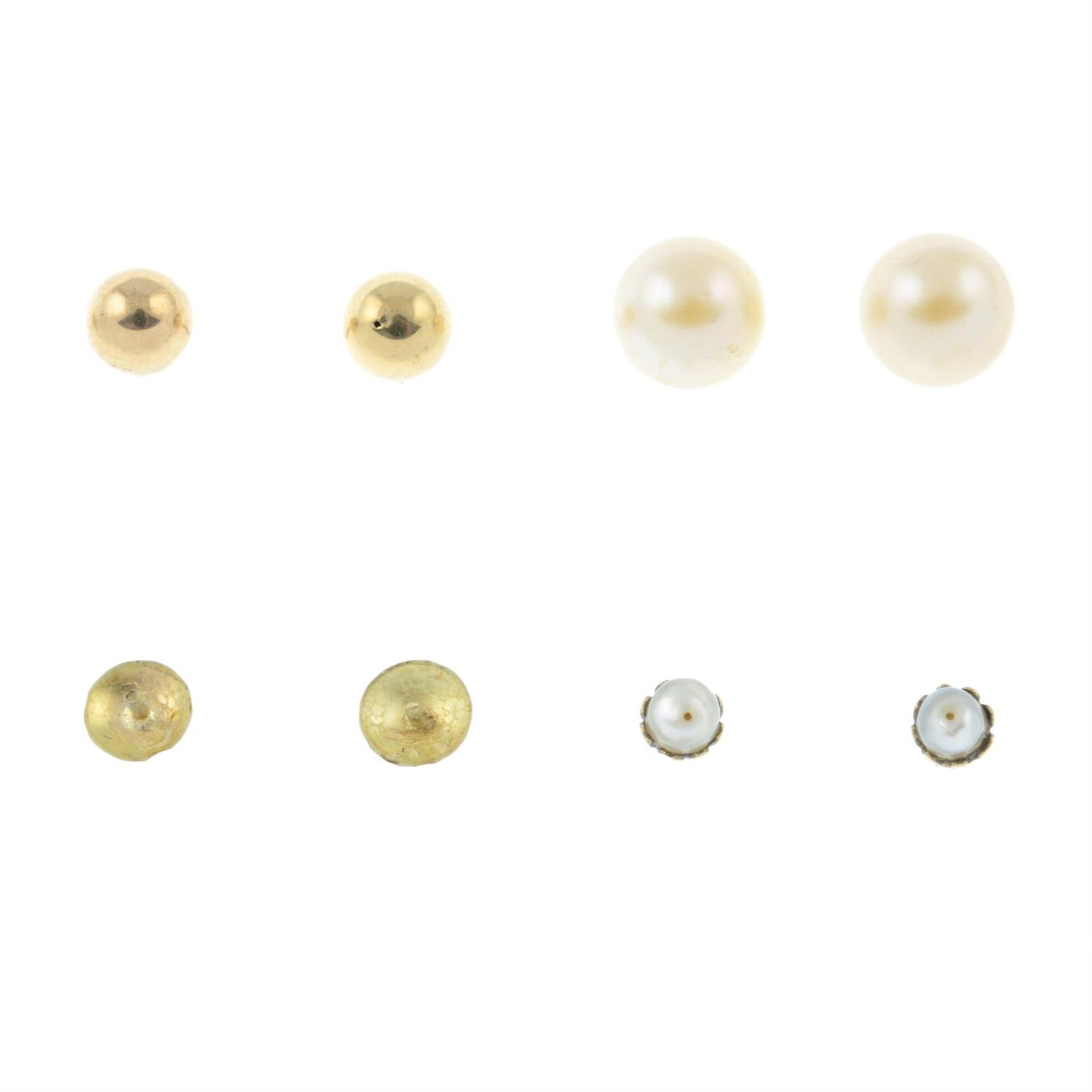 A pair of pearl stud earrings, a similar bead pair and a set of three band rings.
