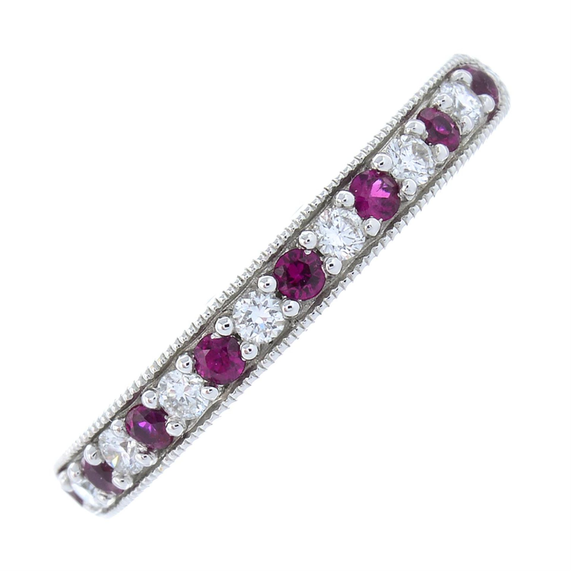 An 18ct gold ruby and diamond half-eternity ring.