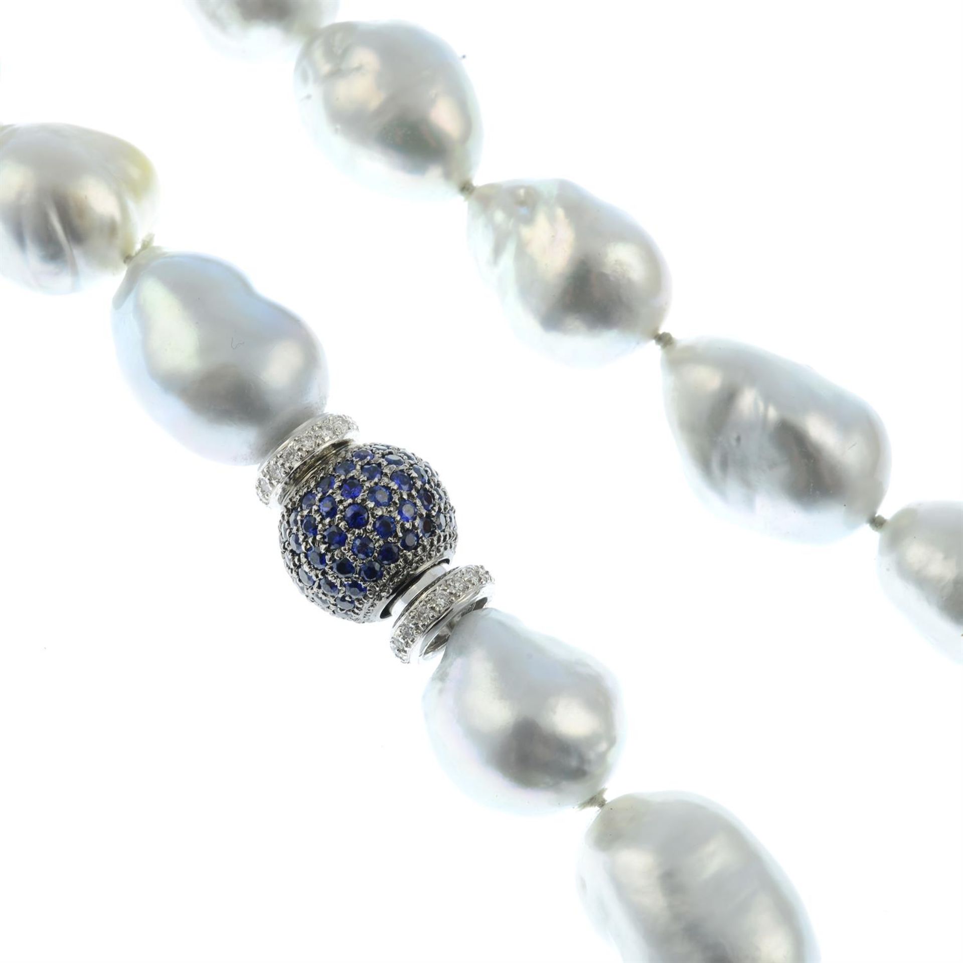 A baroque cultured pearl single-strand necklace, with 18ct gold pavé-set sapphire and diamond clasp.