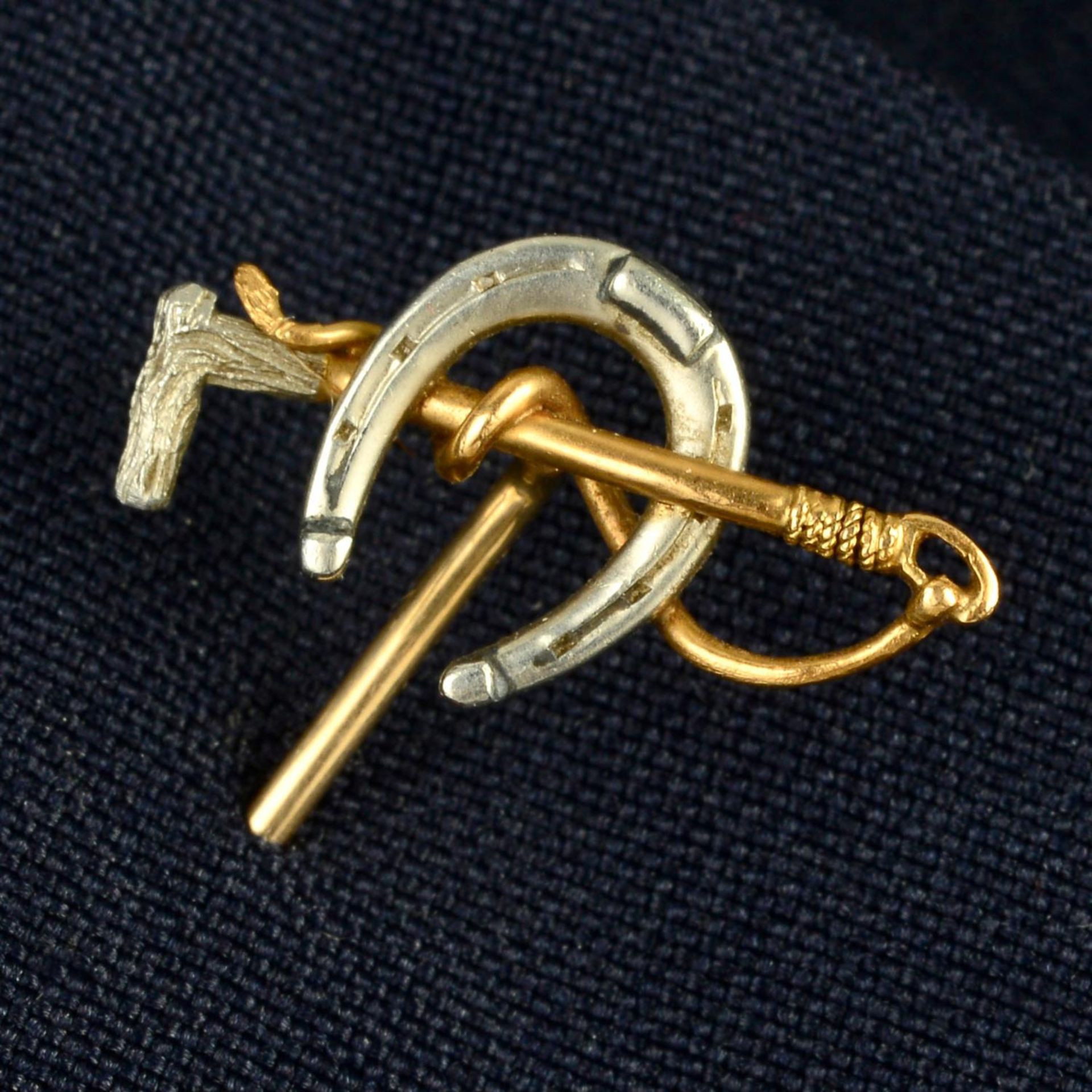 A late 19th to early 20th century platinum and 18ct gold equestrian themed stickpin,