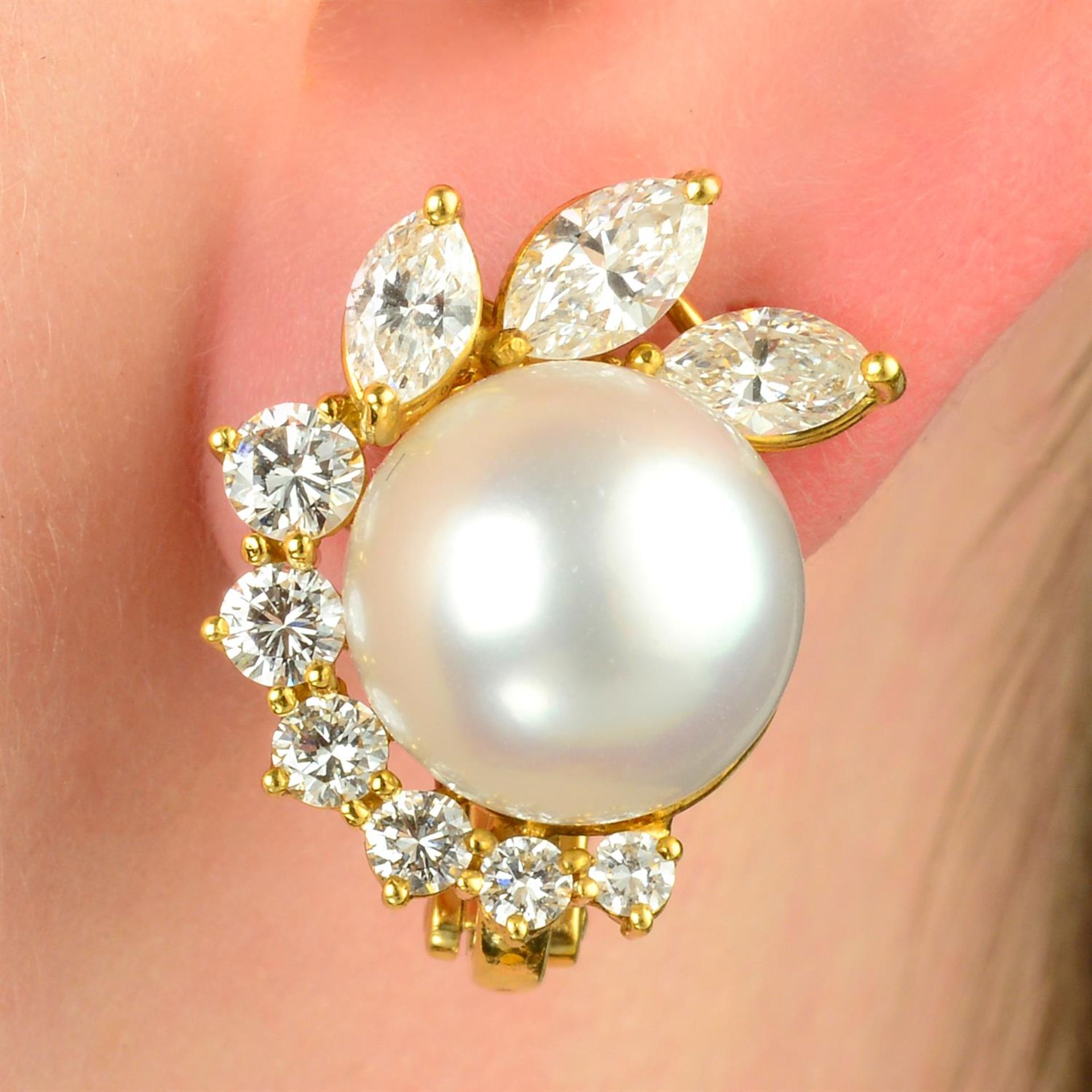 A pair of cultured pearl and vari-cut diamond foliate earrings, by Carl Bucherer.