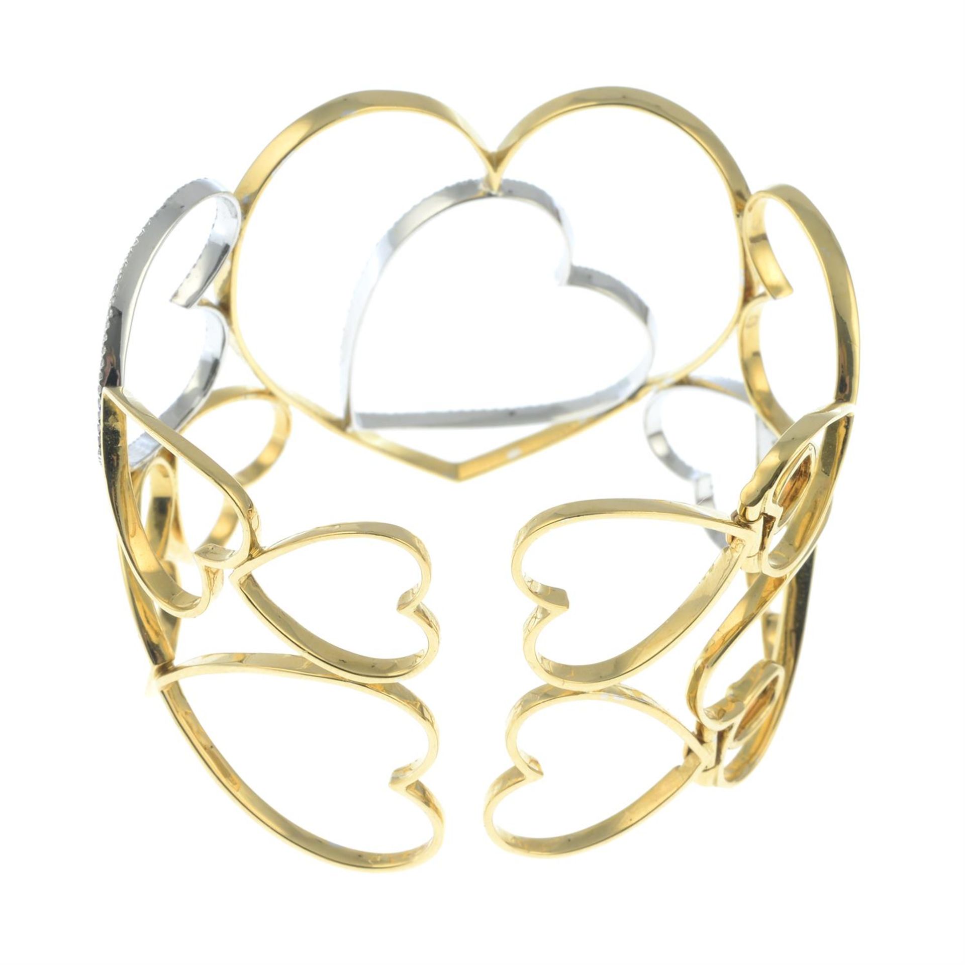 An openwork heart motif bangle, with diamond highlights. - Image 4 of 4