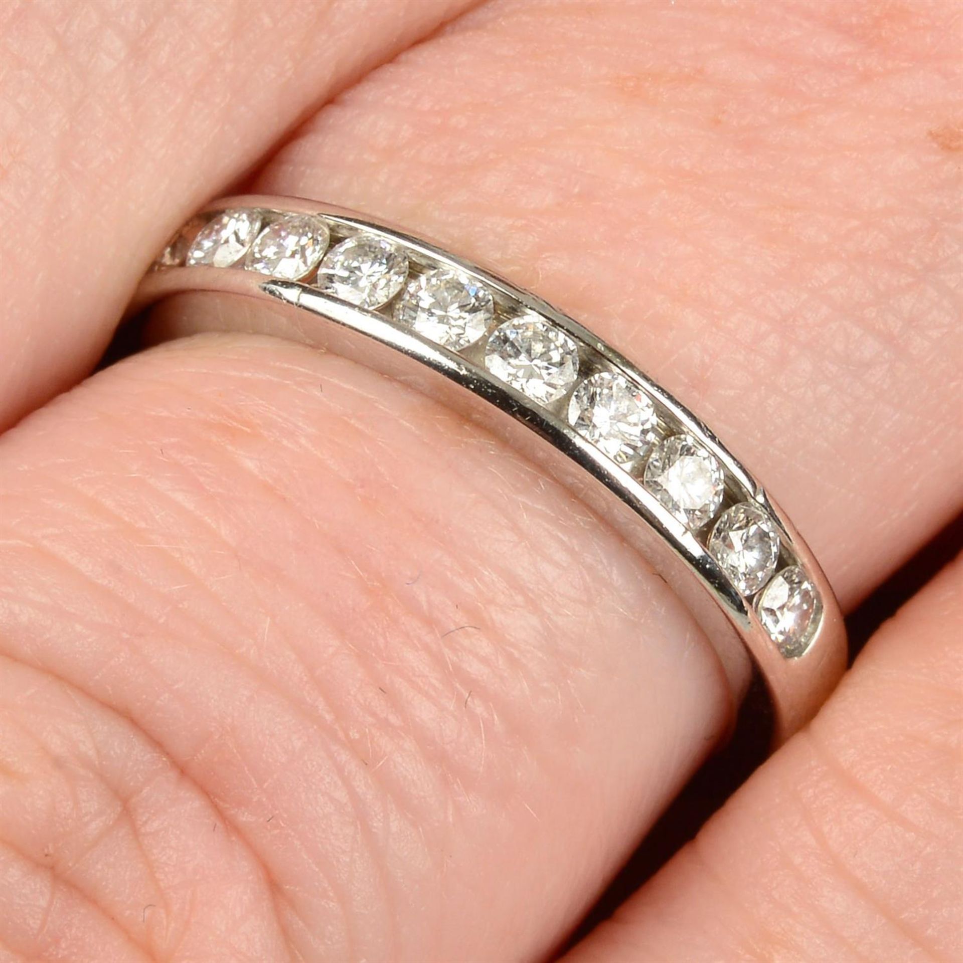 A platinum brilliant-cut diamond half eternity ring, by Tiffany & Co.
