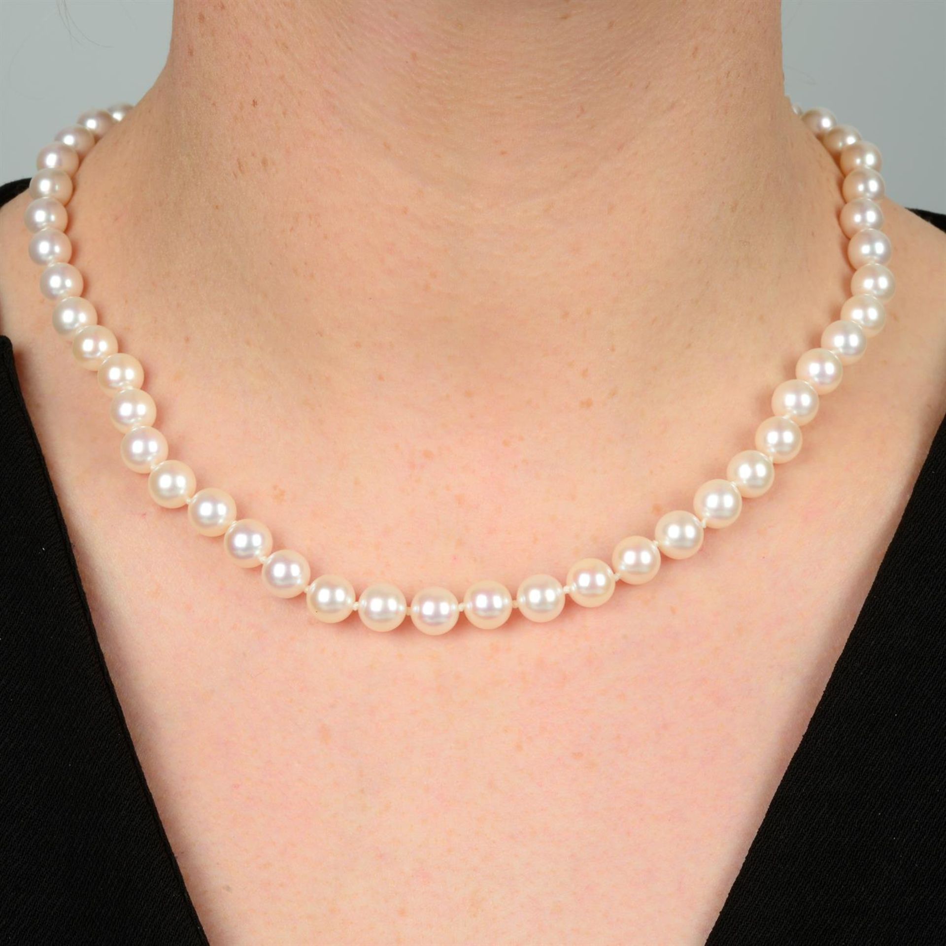 A slightly graduated cultured pearl single-strand necklace, by Mikimoto.