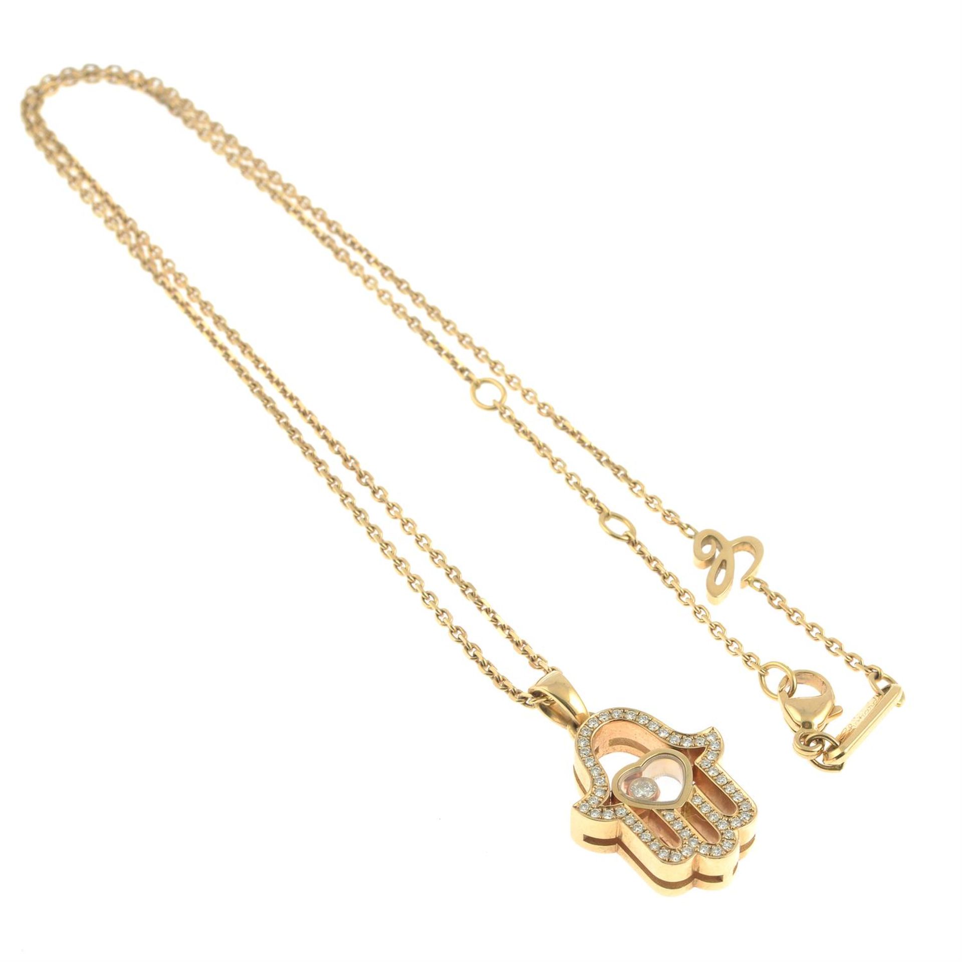 An 18ct gold brilliant-cut diamond 'Happy Diamonds' Hamsa Hand pendant, with chain, by Chopard. - Image 4 of 5