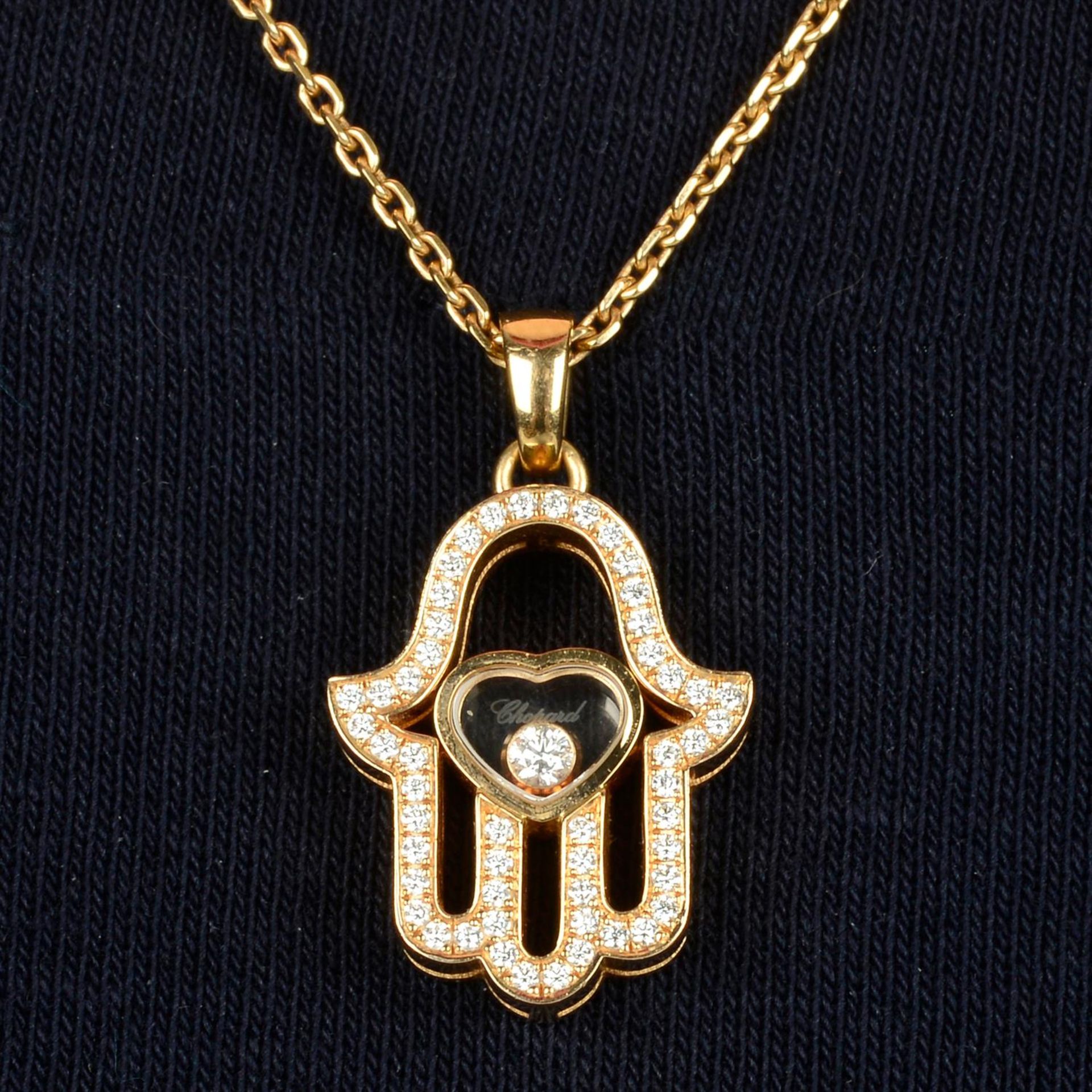 An 18ct gold brilliant-cut diamond 'Happy Diamonds' Hamsa Hand pendant, with chain, by Chopard.