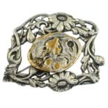 A floral brooch.