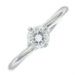 A platinum brilliant-cut diamond single-stone ring.