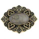 A Victorian enamel mourning brooch, with decorative hair panel.