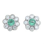 A pair of emerald and diamond cluster earrings.