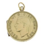 An early 20th century gold 1948 shilling locket.