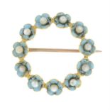 A late 19th century gold blue enamel and seed pearl wreath brooch.