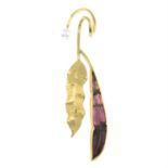 A cultured pearl and carved pink tourmaline foliate pendant.