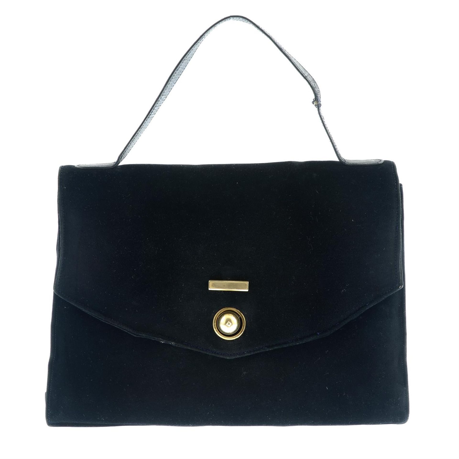 CARTIER - a 1930s black suede leather handbag with 9ct gold hardware.